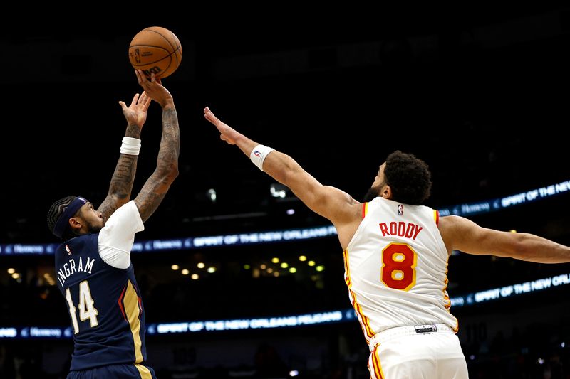 NEW ORLEANS, LOUISIANA - NOVEMBER 03: Brandon Ingram #14 of the New Orleans Pelicans shoots over David Roddy #8 of the Atlanta Hawks during the fourth quarter of an NBA game at Smoothie King Center on November 03, 2024 in New Orleans, Louisiana. NOTE TO USER: User expressly acknowledges and agrees that, by downloading and or using this photograph, User is consenting to the terms and conditions of the Getty Images License Agreement. (Photo by Sean Gardner/Getty Images)