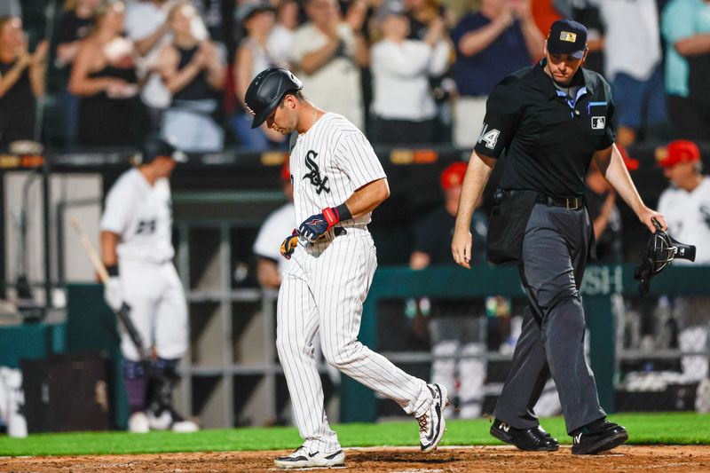 Jul 4, 2023; Chicago, Illinois, USA; Chicago White Sox left fielder Andrew Benintendi (23) scores against the Toronto Blue Jays during the sixth inning at Guaranteed Rate Field. Mandatory Credit: Kamil Krzaczynski-USA TODAY Sports