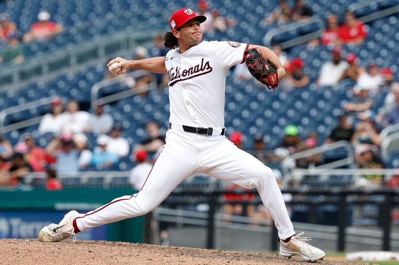 Jul 21, 2024; Washington, District of Columbia, USA; Washington Nationals closing pitcher Kyle Finnegan (67) pitches against the Cincinnati Reds during the ninth inning at Nationals Park. Mandatory Credit: Geoff Burke-USA TODAY Sports