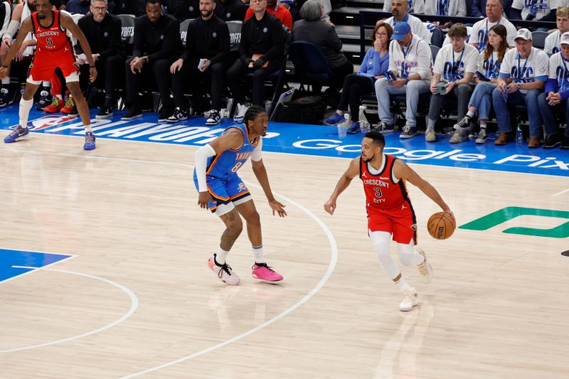 OKLAHOMA CITY, OK - APRIL 24: CJ McCollum #3 of the New Orleans Pelicans dribbles the ball during the game against the Oklahoma City Thunder during Round 1 Game 2 of the 2024 NBA Playoffs on April 24, 2024 at Paycom Arena in Oklahoma City, Oklahoma. NOTE TO USER: User expressly acknowledges and agrees that, by downloading and or using this photograph, User is consenting to the terms and conditions of the Getty Images License Agreement. Mandatory Copyright Notice: Copyright 2024 NBAE (Photo by Martin McGrew/NBAE via Getty Images)