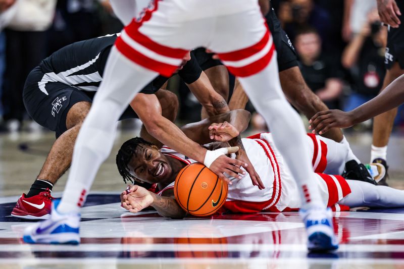 Jan 27, 2025; Tucson, Arizona, USA; Arizona Wildcats guard Jaden Bradley (0) attempts to grab the ball during the overtime against the Iowa State at McKale Center. Mandatory Credit: Aryanna Frank-Imagn Images