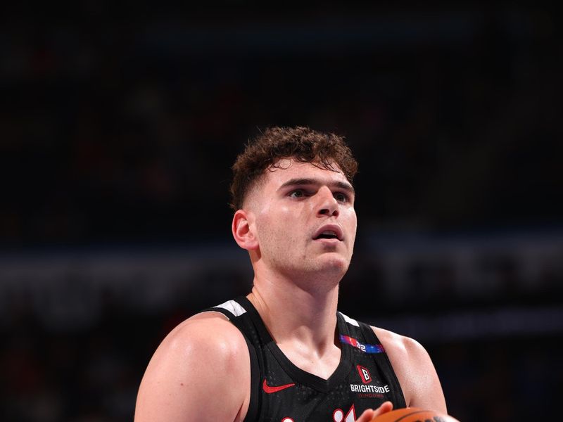 OKLAHOMA CITY, OK - NOVEMBER 20: Donovan Clingan #23 of the Portland Trail Blazers shoots a free throw during the game against the Oklahoma City Thunder on November 20, 2024 at Paycom Center in Oklahoma City, Oklahoma. NOTE TO USER: User expressly acknowledges and agrees that, by downloading and or using this photograph, User is consenting to the terms and conditions of the Getty Images License Agreement. Mandatory Copyright Notice: Copyright 2024 NBAE (Photo by Zach Beeker/NBAE via Getty Images)