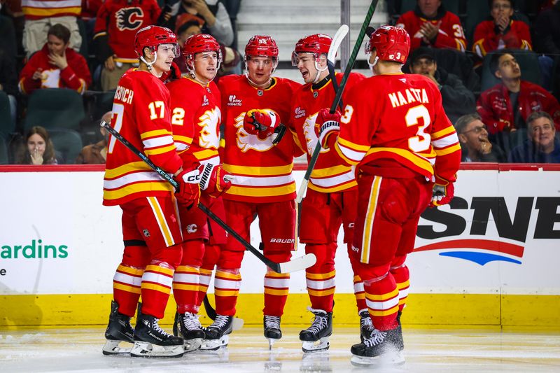 Mar 28, 2026; Calgary, Alberta, CAN; Calgary Flames center Ryan Strome (22) celebrates his goal with teammates against the Vancouver Canucks during the second period at Scotiabank Saddledome. Mandatory Credit: Sergei Belski-Imagn Images