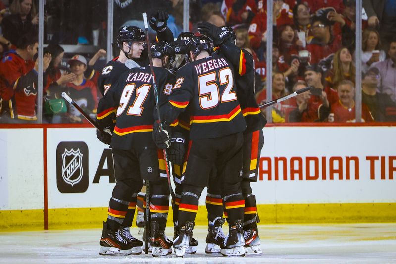 Apr 2, 2024; Calgary, Alberta, CAN; Calgary Flames center Yegor Sharangovich (17) celebrates his goal with teammates against the Anaheim Ducks during the second period at Scotiabank Saddledome. Mandatory Credit: Sergei Belski-USA TODAY Sports
