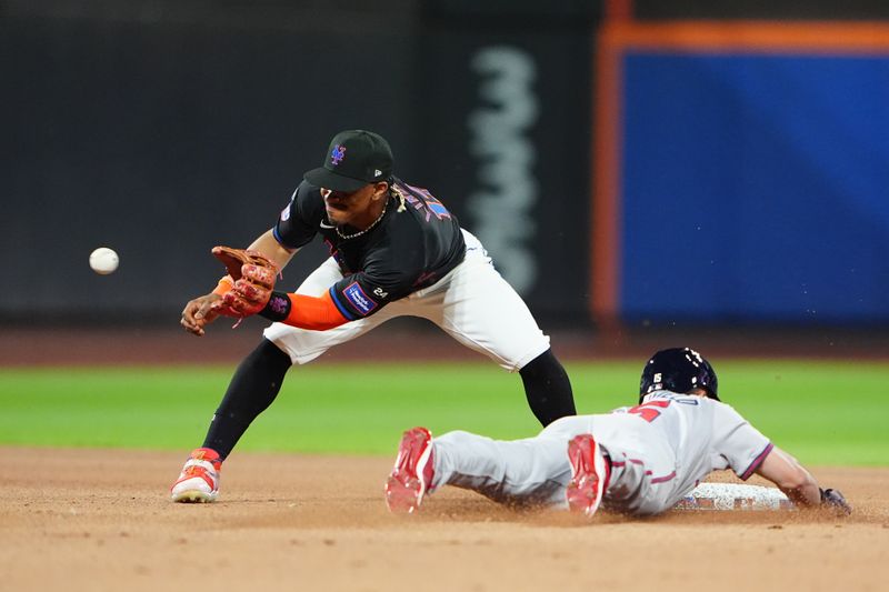 Jul 25, 2024; New York City, New York, USA; Atlanta Braves right fielder Brian Anderson (15) steals second base with New York Mets shortstop Francisco Lindor (12) receiving the throw during the ninth inning at Citi Field. Mandatory Credit: Gregory Fisher-USA TODAY Sports