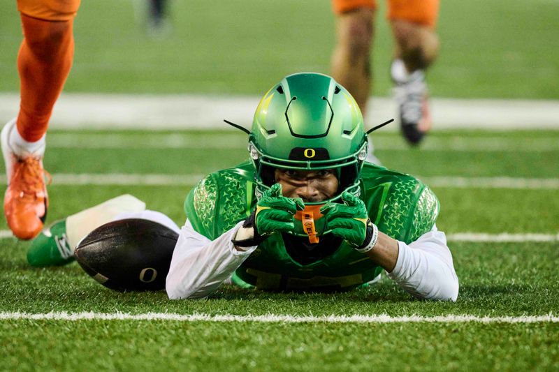 Nov 24, 2023; Eugene, Oregon, USA; Oregon Ducks wide receiver Tez Johnson (15) signals first down after catching a pass during the second half against the Oregon State Beavers at Autzen Stadium. Mandatory Credit: Troy Wayrynen-USA TODAY Sports