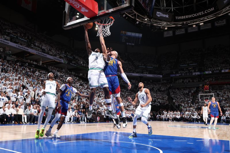 MINNEAPOLIS, MN - MAY 16: Anthony Edwards #5 of the Minnesota Timberwolves drives to the basket during the game against the Denver Nuggets during Round 2 Game 6 of the 2024 NBA Playoffs on May 16, 2024 at Target Center in Minneapolis, Minnesota. NOTE TO USER: User expressly acknowledges and agrees that, by downloading and or using this Photograph, user is consenting to the terms and conditions of the Getty Images License Agreement. Mandatory Copyright Notice: Copyright 2024 NBAE (Photo by David Sherman/NBAE via Getty Images)