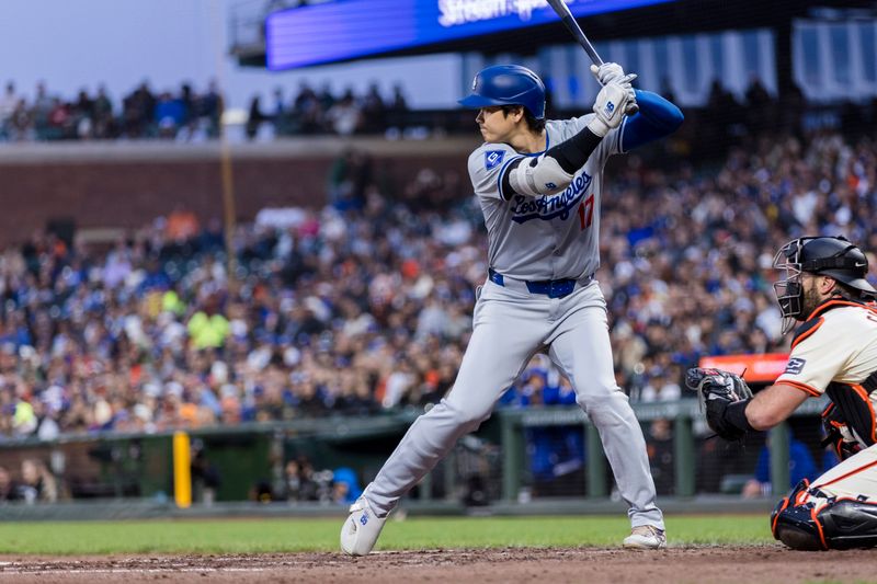 May 15, 2024; San Francisco, California, USA; Los Angeles Dodgers designated hitter Shohei Ohtani (17) hits a single against the San Francisco Giants during the fifth inning at Oracle Park. Mandatory Credit: John Hefti-USA TODAY Sports