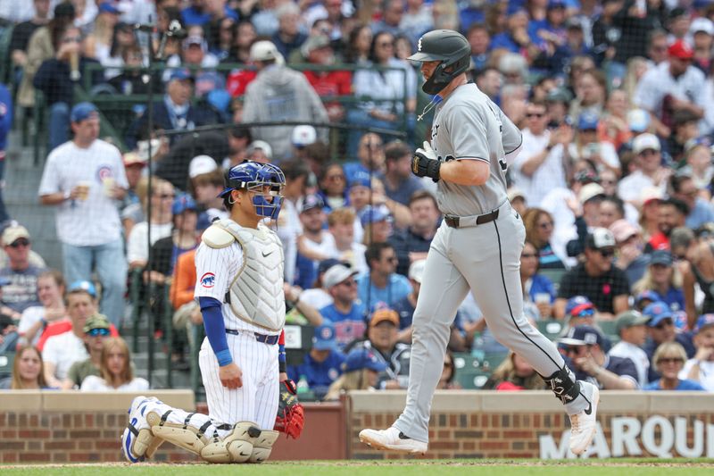 May 17, 2025; Chicago, Illinois, USA; Chicago White Sox first baseman Tim Elko (30) crosses home plate after hitting a solo home run against the Chicago Cubs during the fifth inning at Wrigley Field. Mandatory Credit: Kamil Krzaczynski-Imagn Images