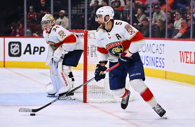 Mar 21, 2023; Philadelphia, Pennsylvania, USA; Florida Panthers defenseman Aaron Ekblad (5) controls the puck against the Philadelphia Flyers in the third period at Wells Fargo Center. Mandatory Credit: Kyle Ross-USA TODAY Sports