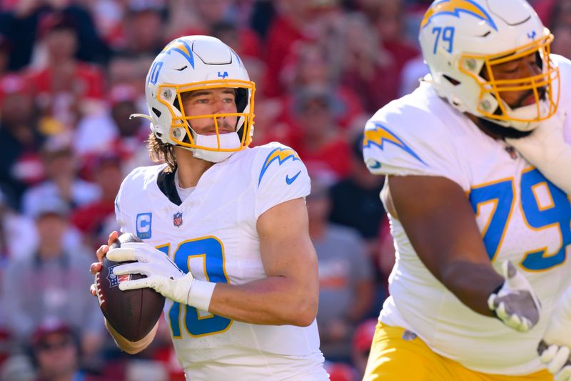 Los Angeles Chargers quarterback Justin Herbert looks to pass during the first half of an NFL football game against the Kansas City Chiefs, Sunday, Oct. 22, 2023 in Kansas City, Mo. (AP Photo/Reed Hoffmann)