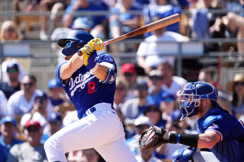 Mar 9, 2024; Phoenix, Arizona, USA; Los Angeles Dodgers second baseman Enrique Hernandez (8) bats against the Texas Rangers during the second inning at Camelback Ranch-Glendale. Mandatory Credit: Joe Camporeale-USA TODAY Sports