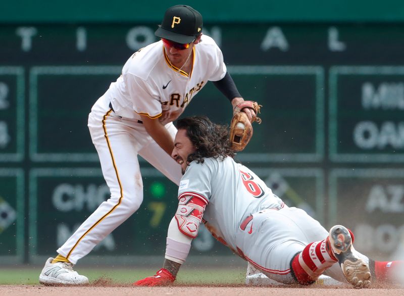 Aug 25, 2024; Pittsburgh, Pennsylvania, USA;  Cincinnati Reds second baseman Jonathan India (6) arrives at second base with a double as Pittsburgh Pirates second baseman Alika Williams (25) makes a late tag during the seventh inning at PNC Park. Mandatory Credit: Charles LeClaire-USA TODAY Sports