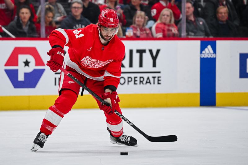 Apr 5, 2024; Detroit, Michigan, USA; Detroit Red Wings defenseman Shayne Gostisbehere (41) makes an assist to Detroit Red Wings center Dylan Larkin (not pictured) during the second period against the New York Rangers at Little Caesars Arena. Mandatory Credit: Tim Fuller-USA TODAY Sports