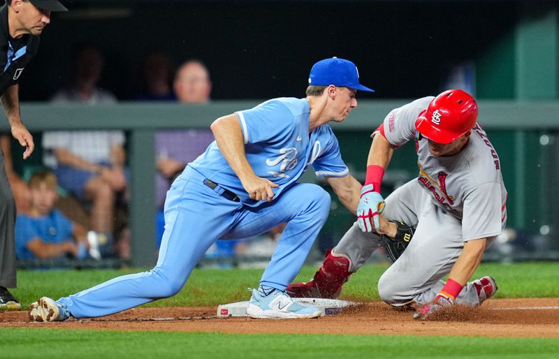 Aug 11, 2023; Kansas City, Missouri, USA; St. Louis Cardinals center fielder Lars Nootbaar (21) is caught trying to stretch a double against Kansas City Royals third baseman Matt Duffy (15) during the sixth inning at Kauffman Stadium. Mandatory Credit: Jay Biggerstaff-USA TODAY Sports