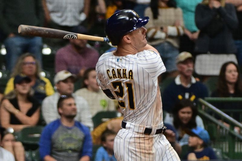Sep 16, 2023; Milwaukee, Wisconsin, USA; Milwaukee Brewers left fielder Mark Canha (21) hits a grand slam homer in the eighth inning against the Washington Nationals at American Family Field. Mandatory Credit: Benny Sieu-USA TODAY Sports