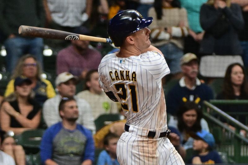 Sep 16, 2023; Milwaukee, Wisconsin, USA; Milwaukee Brewers left fielder Mark Canha (21) hits a grand slam homer in the eighth inning against the Washington Nationals at American Family Field. Mandatory Credit: Benny Sieu-USA TODAY Sports