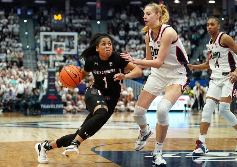 Feb 5, 2023; Hartford, Connecticut, USA; South Carolina Gamecocks guard Zia Cooke (1) drives the ball against UConn Huskies forward Dorka Juhasz (14) in the second half at XL Center. Mandatory Credit: David Butler II-USA TODAY Sports