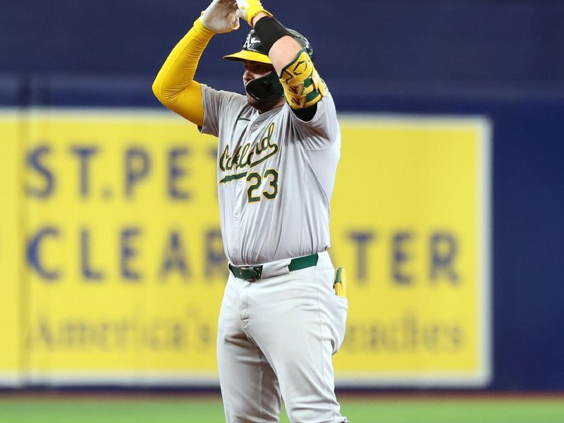 May 30, 2024; St. Petersburg, Florida, USA; Oakland Athletics catcher Shea Langeliers (23) doubles against the Tampa Bay Rays during the second inning at Tropicana Field. Mandatory Credit: Kim Klement Neitzel-USA TODAY Sports