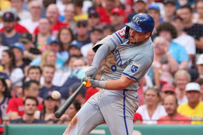 Jul 12, 2024; Boston, Massachusetts, USA; Kansas City Royals first baseman Vinnie Pasquantino (9) hits a sacrifice fly to score a run during the second inning against the Boston Red Sox at Fenway Park. Mandatory Credit: Paul Rutherford-USA TODAY Sports