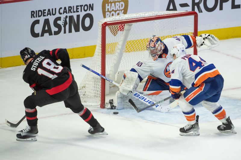 Nov 24 2023; Ottawa, Ontario, CAN; New York Islanders goalie Semyon Valarmov (40) makes a save on a shot from Ottawa Senators center Tim Stutzle (18) in the third period at the Canadian Tire Centre. Mandatory Credit: Marc DesRosiers-USA TODAY Sports