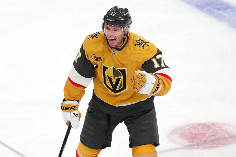 Mar 19, 2024; Las Vegas, Nevada, USA; Vegas Golden Knights defenseman Ben Hutton (17) celebrates after scoring  a goal against the Tampa Bay Lightning during the third period at T-Mobile Arena. Mandatory Credit: Stephen R. Sylvanie-USA TODAY Sports