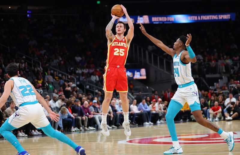 ATLANTA, GEORGIA - APRIL 10:  Garrison Mathews #25 of the Atlanta Hawks shoots a three-point basket against Brandon Miller #24 of the Charlotte Hornets during the first quarter at State Farm Arena on April 10, 2024 in Atlanta, Georgia.  NOTE TO USER: User expressly acknowledges and agrees that, by downloading and/or using this photograph, user is consenting to the terms and conditions of the Getty Images License Agreement.  (Photo by Kevin C. Cox/Getty Images)