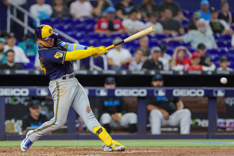 Sep 24, 2023; Miami, Florida, USA; Milwaukee Brewers catcher William Contreras (24) hits a double against the Miami Marlins during the third inning at loanDepot Park. Mandatory Credit: Sam Navarro-USA TODAY Sports