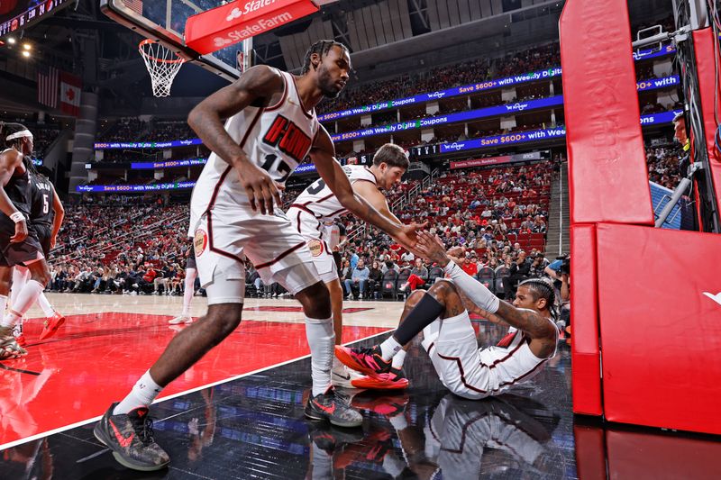 HOUSTON, TX -NOVEMBER 23:  Teammates help Jalen Green #4 of the Houston Rockets off the floor during the game against the Portland Trail Blazers on November 23, 2024 at the Toyota Center in Houston, Texas. NOTE TO USER: User expressly acknowledges and agrees that, by downloading and or using this photograph, User is consenting to the terms and conditions of the Getty Images License Agreement. Mandatory Copyright Notice: Copyright 2024 NBAE (Photo by Logan Riely/NBAE via Getty Images)