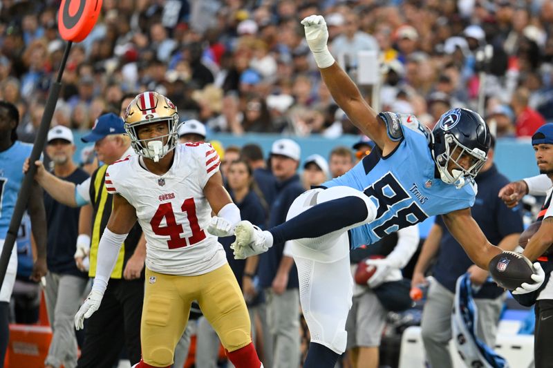 Tennessee Titans tight end David Martin-Robinson (88) tries to stay in bounds after making a catch in front San Francisco 49ers safety Tayler Hawkins (41) during the first half of an NFL preseason football game, Saturday, Aug. 10, 2024, in Nashville, Tenn. (AP Photo/)