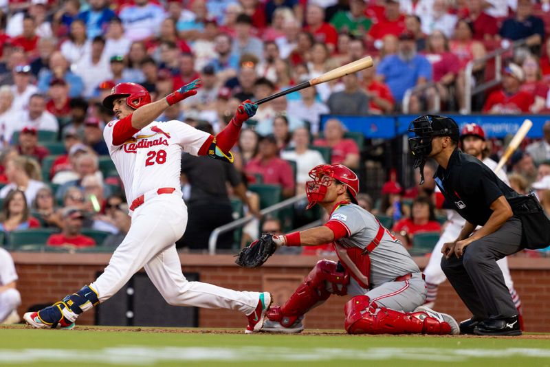 Jun 27, 2024; St. Louis, Missouri, USA; St. Louis Cardinals third baseman Nolan Arenado (28) hits a two-run home run against the Cincinnati Reds in the third inning at Busch Stadium. Mandatory Credit: Zach Dalin-USA TODAY Sports