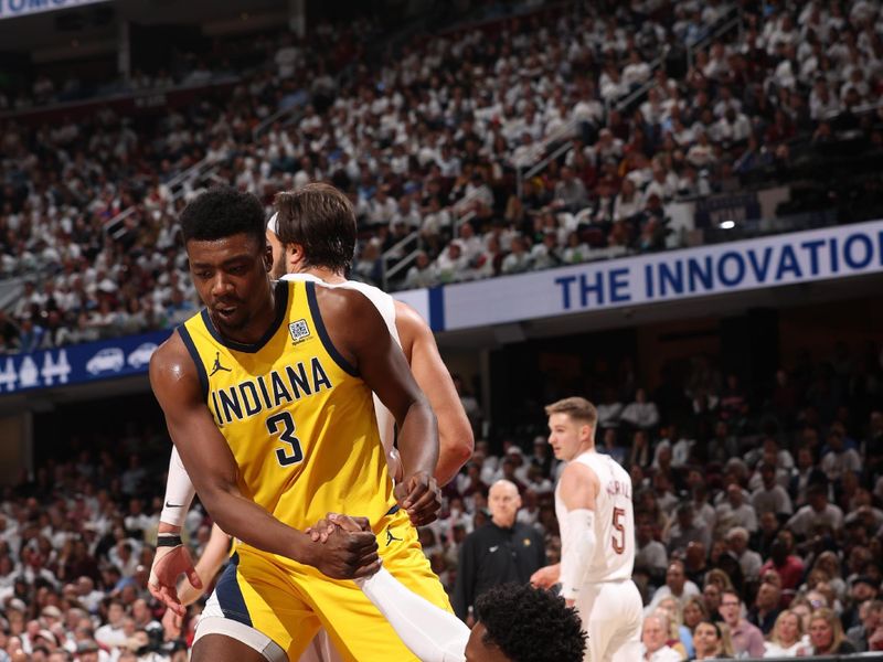 CLEVELAND, OH - MAY 6: Bennedict Mathurin #00 is helped up by Thomas Bryant #3 of the Indiana Pacers during the game against the Cleveland Cavaliers during Round 2 Game 2 of the 2025 NBA Playoffs on May 6, 2025 at Rocket Arena in Cleveland, Ohio. NOTE TO USER: User expressly acknowledges and agrees that, by downloading and/or using this Photograph, user is consenting to the terms and conditions of the Getty Images License Agreement. Mandatory Copyright Notice: Copyright 2025 NBAE (Photo by Joe Murphy/NBAE via Getty Images)
