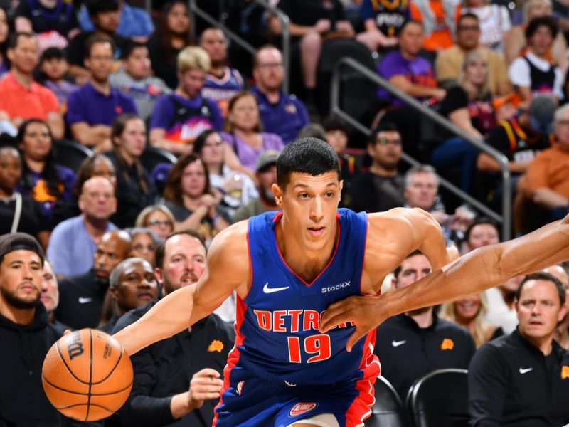 PHOENIX, AZ - OCTOBER 11: Simone Fontecchio #19 of the Detroit Pistons drives to the basket during the game against the Phoenix Suns during a NBA preseason game on October 11, 2024 at Footprint Center in Phoenix, Arizona. NOTE TO USER: User expressly acknowledges and agrees that, by downloading and or using this photograph, user is consenting to the terms and conditions of the Getty Images License Agreement. Mandatory Copyright Notice: Copyright 2024 NBAE (Photo by Barry Gossage/NBAE via Getty Images)