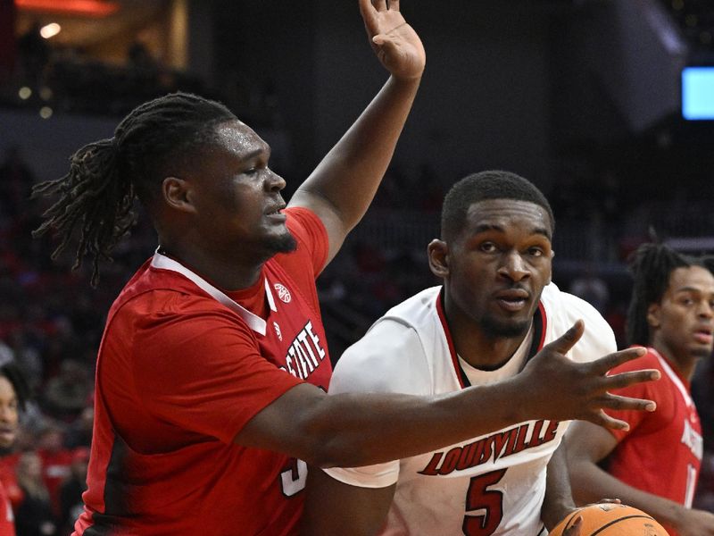 Jan 13, 2024; Louisville, Kentucky, USA;  North Carolina State Wolfpack forward DJ Burns Jr. (30) pressure Louisville Cardinals forward Brandon Huntley-Hatfield (5) during the second half at KFC Yum! Center. Mandatory Credit: Jamie Rhodes-USA TODAY Sports