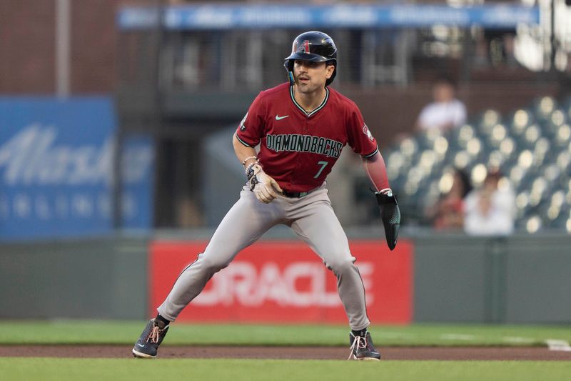 Sep 4, 2024; San Francisco, California, USA;  Arizona Diamondbacks outfielder Corbin Carroll (7) takes a lead during the first inning against the San Francisco Giants at Oracle Park. Mandatory Credit: Stan Szeto-Imagn Images