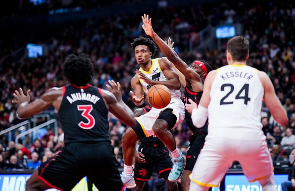 TORONTO, ON - DECEMBER 23: Collin Sexton #2 of the Utah Jazz passes the ball of against the Toronto Raptors during the second half of their basketball game at the Scotiabank Arena on December 23, 2023 in Toronto, Ontario, Canada. NOTE TO USER: User expressly acknowledges and agrees that, by downloading and/or using this Photograph, user is consenting to the terms and conditions of the Getty Images License Agreement. (Photo by Mark Blinch/Getty Images)