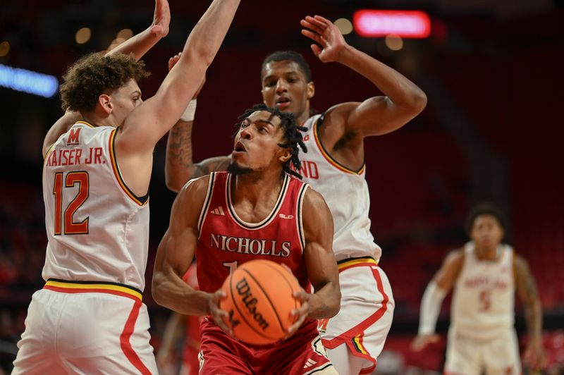 Dec 19, 2023; College Park, Maryland, USA; Nicholls State Colonels forward Jamal West Jr. (15) looks to shoot as Maryland Terrapins forward Jamie Kaiser Jr. (12) defends during the first half  at Xfinity Center. Mandatory Credit: Tommy Gilligan-USA TODAY Sports