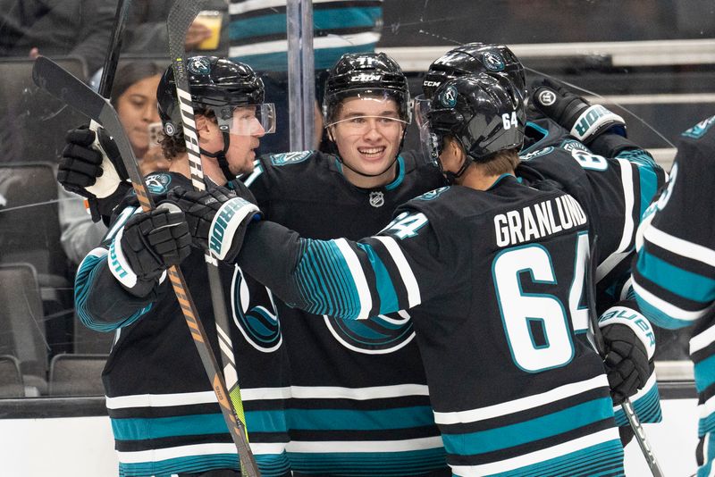 Nov 7, 2024; San Jose, California, USA;  San Jose Sharks center Macklin Celebrini (71) celebrates with teammates after scoring a goal during the second period against the Minnesota Wild at SAP Center at San Jose. Mandatory Credit: Stan Szeto-Imagn Images