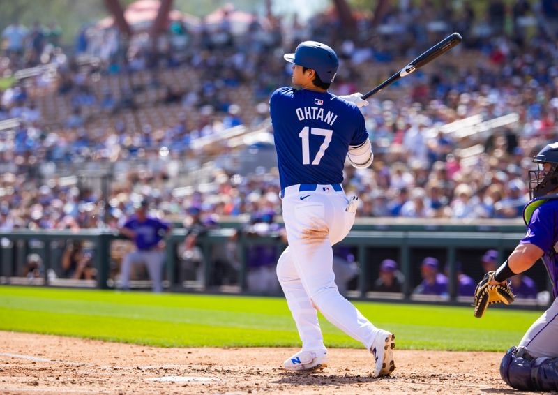 Mar 3, 2024; Phoenix, Arizona, USA; Los Angeles Dodgers designated hitter Shohei Ohtani against the Colorado Rockies during a spring training game at Camelback Ranch-Glendale. Mandatory Credit: Mark J. Rebilas-USA TODAY Sports