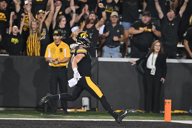 Sep 30, 2023; Iowa City, Iowa, USA; Iowa Hawkeyes defensive back Cooper DeJean (3) scores a touchdown on a punt return against the Michigan State Spartans during the fourth quarter at Kinnick Stadium. Mandatory Credit: Jeffrey Becker-USA TODAY Sports