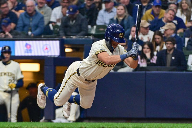 Apr 2, 2024; Milwaukee, Wisconsin, USA; Milwaukee Brewers right fielder Sal Frelick (10) avoids getting hit by a pitch in the sixth inning against the Minnesota Twins at American Family Field. Mandatory Credit: Benny Sieu-USA TODAY Sports