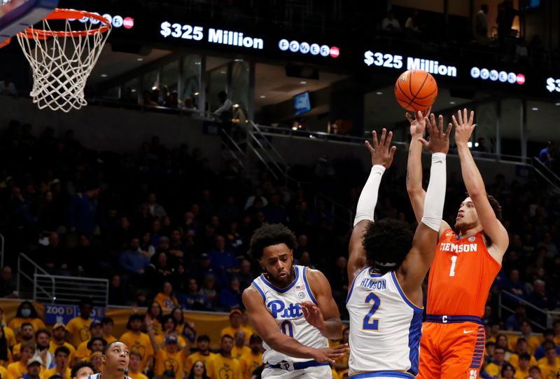 Jan 7, 2023; Pittsburgh, Pennsylvania, USA;  Clemson Tigers guard Chase Hunter (1) shoots against Pittsburgh Panthers guard Nelly Cummings (0) and forward Blake Hinson (2) during the first half at the Petersen Events Center. Mandatory Credit: Charles LeClaire-USA TODAY Sports