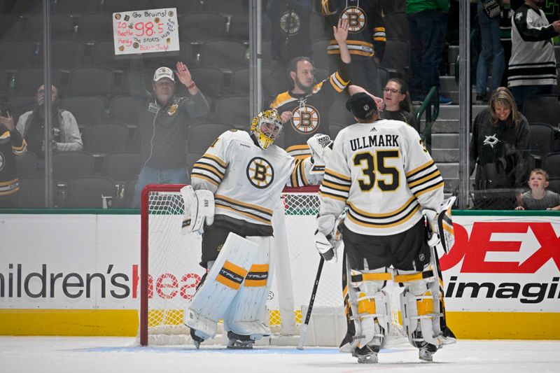 Nov 6, 2023; Dallas, Texas, USA;  Boston Bruins goaltender Jeremy Swayman (1) and goaltender Linus Ullmark (35) celebrate on the ice after the Bruins victory over the Dallas Stars at the American Airlines Center. Mandatory Credit: Jerome Miron-USA TODAY Sports