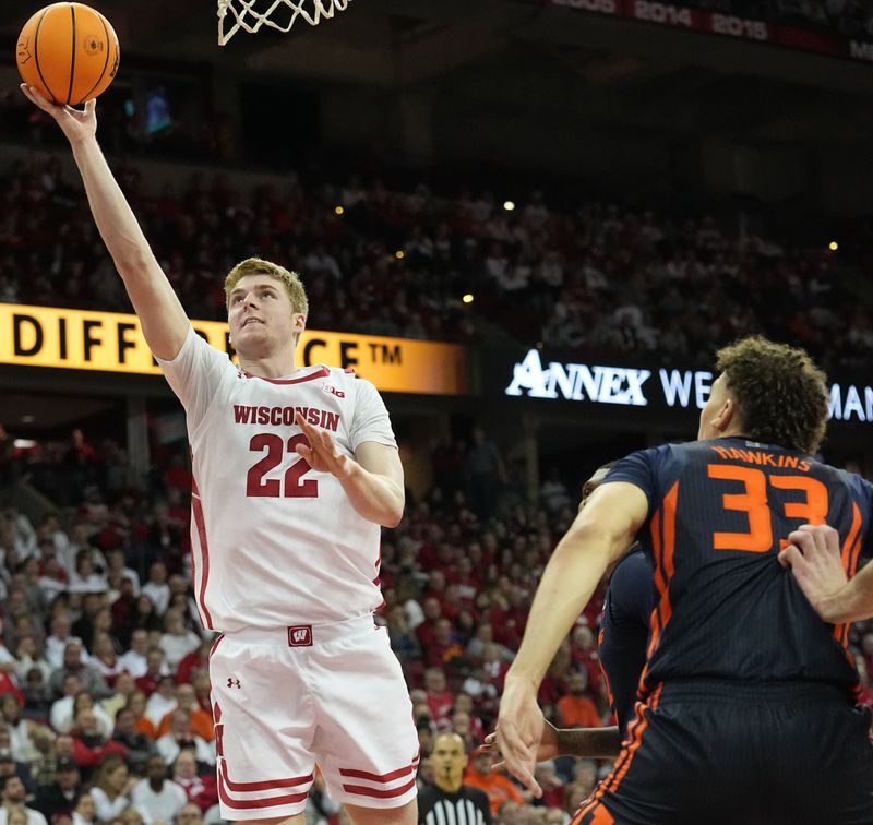 Jan 1, 2023; Madison, Wis, USA; Wisconsin forward Steven Crowl (22) scores during the second half of their game at the Kohl Center. Mandatory Credit: Mark Hoffman/Milwaukee Journal Sentinel via USA TODAY NETWORK