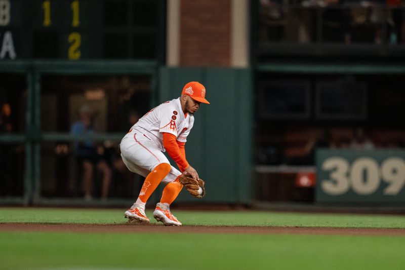 Aug 29, 2023; San Francisco, California, USA;  San Francisco Giants second baseman Thairo Estrada (39) fields a ground ball during the seventh inning against the Cincinnati Reds at Oracle Park. Mandatory Credit: Neville E. Guard-USA TODAY Sports