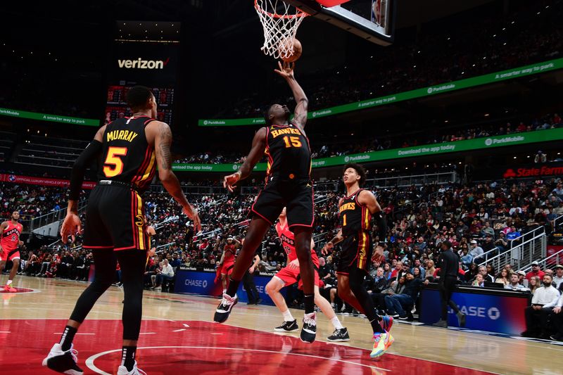 ATLANTA, GA - February 23: Clint Capela #15 of the Atlanta Hawks grabs a rebound during the game against the Toronto Raptors on February 23, 2024 at State Farm Arena in Atlanta, Georgia.  NOTE TO USER: User expressly acknowledges and agrees that, by downloading and/or using this Photograph, user is consenting to the terms and conditions of the Getty Images License Agreement. Mandatory Copyright Notice: Copyright 2024 NBAE (Photo by Scott Cunningham/NBAE via Getty Images)