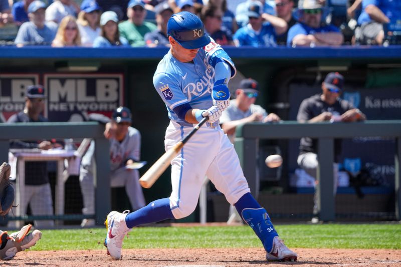 May 22, 2024; Kansas City, Missouri, USA; Kansas City Royals catcher Freddy Fermin (34) hits a two run single against the Detroit Tigers in the seventh inning at Kauffman Stadium. Mandatory Credit: Denny Medley-USA TODAY Sports