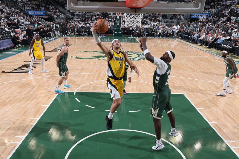 MILWAUKEE, WI - APRIL 23: Andrew Nembhard #2 of the Indiana Pacers drives to the basket during Round 1 Game 2 of the 2024 NBA Playoffs against the Milwaukee Bucks on April 23, 2024 at the Fiserv Forum Center in Milwaukee, Wisconsin. NOTE TO USER: User expressly acknowledges and agrees that, by downloading and or using this Photograph, user is consenting to the terms and conditions of the Getty Images License Agreement. Mandatory Copyright Notice: Copyright 2024 NBAE (Photo by Jeff Haynes/NBAE via Getty Images).