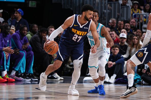 DENVER, CO - JANUARY 1: Jamal Murray #27 of the Denver Nuggets handles the ball during the game against the Charlotte Hornets on January 1, 2024 at the Ball Arena in Denver, Colorado. NOTE TO USER: User expressly acknowledges and agrees that, by downloading and/or using this Photograph, user is consenting to the terms and conditions of the Getty Images License Agreement. Mandatory Copyright Notice: Copyright 2024 NBAE (Photo by Garrett Ellwood/NBAE via Getty Images)