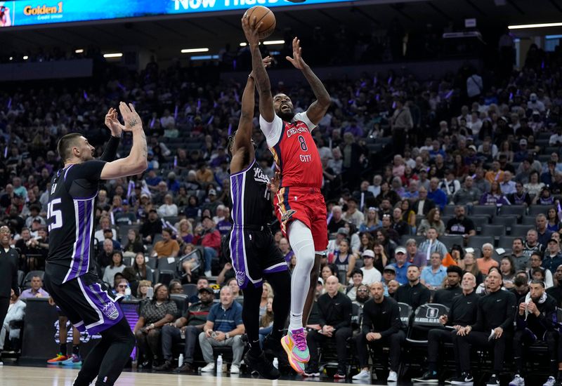 SACRAMENTO, CALIFORNIA - APRIL 11: Naji Marshall #8 of the New Orleans Pelicans shoots over Davion Mitchell #15 of the Sacramento Kings during the first half of an NBA basketball game at Golden 1 Center on April 11, 2024 in Sacramento, California. NOTE TO USER: User expressly acknowledges and agrees that, by downloading and or using this photograph, User is consenting to the terms and conditions of the Getty Images License Agreement. (Photo by Thearon W. Henderson/Getty Images)